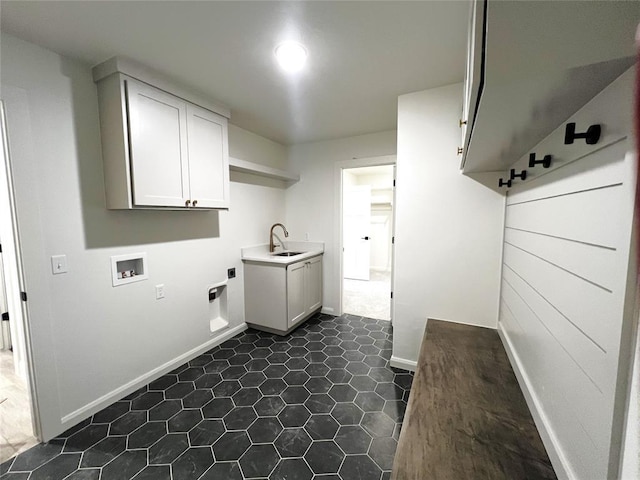 clothes washing area featuring washer hookup, cabinet space, baseboards, and hookup for an electric dryer