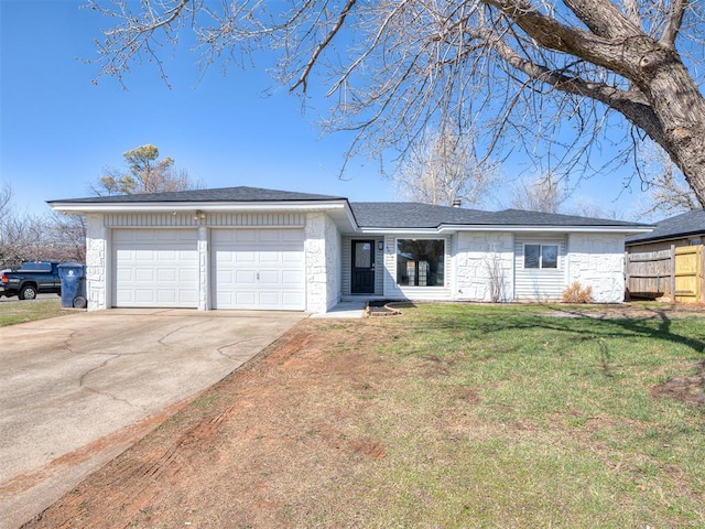 single story home featuring a front lawn, fence, concrete driveway, stone siding, and an attached garage