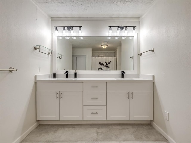 full bathroom with a textured ceiling, crown molding, and a sink