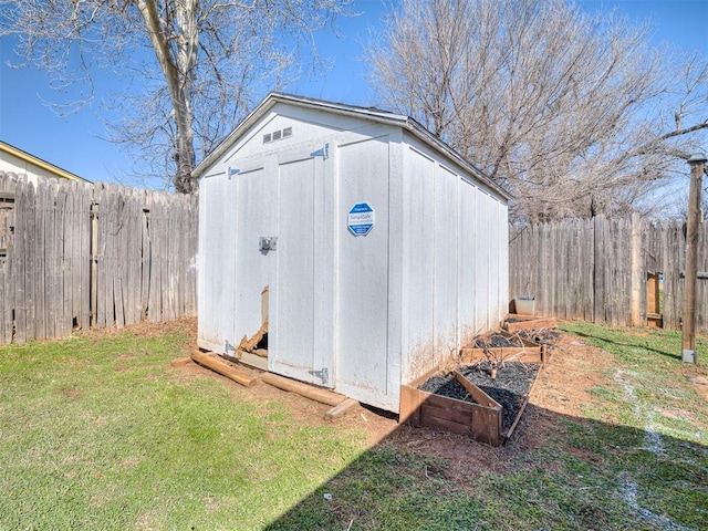 view of shed featuring a fenced backyard