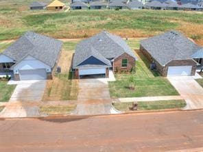 birds eye view of property with a residential view