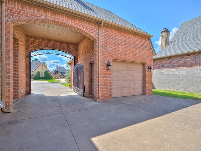 garage with concrete driveway