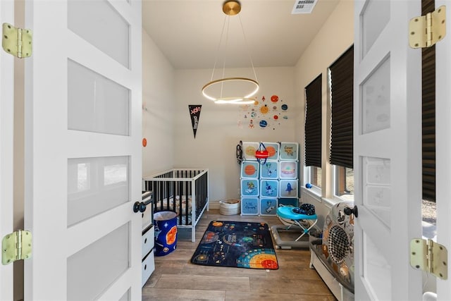 interior space featuring visible vents and wood finished floors