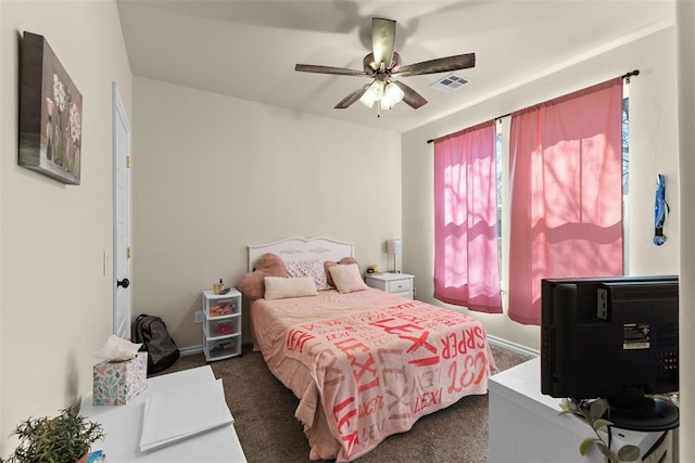 bedroom with a ceiling fan, visible vents, and dark colored carpet