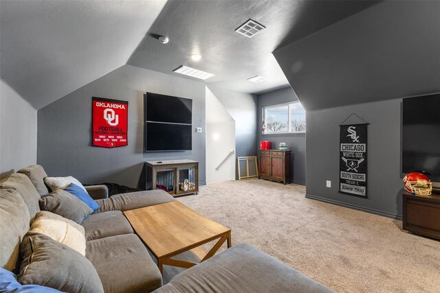 living room with visible vents, lofted ceiling, and light colored carpet