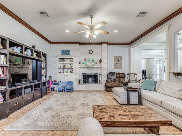 living area with visible vents, a brick fireplace, ceiling fan, and crown molding