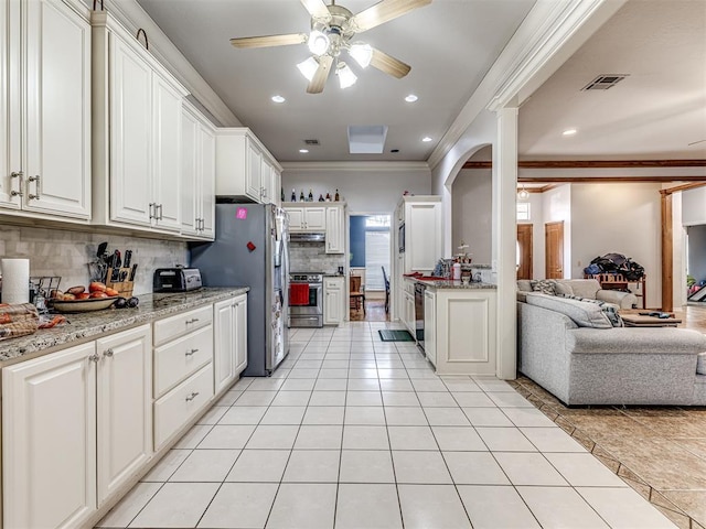 kitchen with visible vents, light tile patterned flooring, appliances with stainless steel finishes, crown molding, and open floor plan