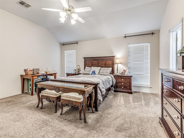 bedroom with visible vents, baseboards, ceiling fan, light colored carpet, and lofted ceiling