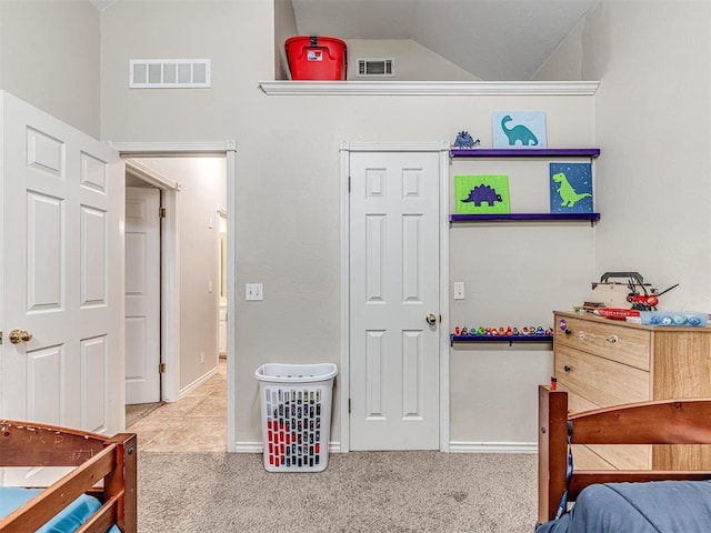 bedroom featuring visible vents, lofted ceiling, baseboards, and carpet flooring