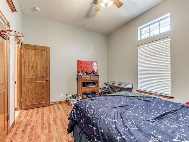 bedroom with visible vents, ceiling fan, and light wood-style floors