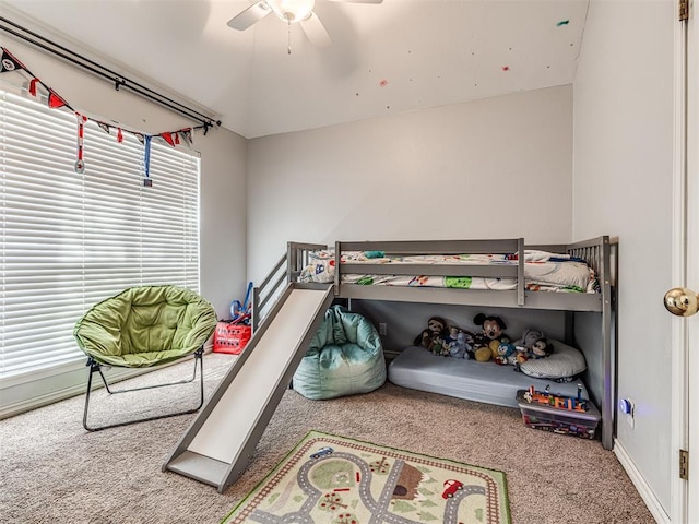 carpeted bedroom with baseboards and ceiling fan