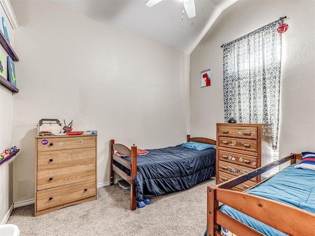 bedroom with baseboards, a ceiling fan, carpet flooring, and vaulted ceiling