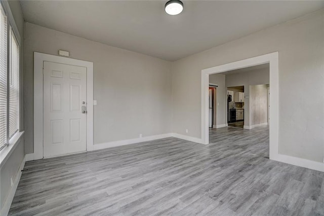 324 NW 24th St, Oklahoma City, OK 73103 - spare room with baseboards and wood finished floors