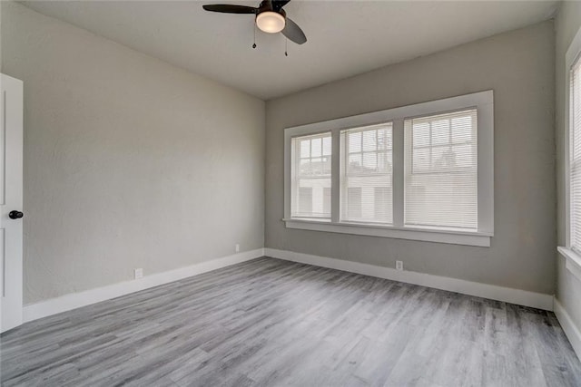324 NW 24th St, Oklahoma City, OK 73103 - spare room with baseboards, ceiling fan, and wood finished floors