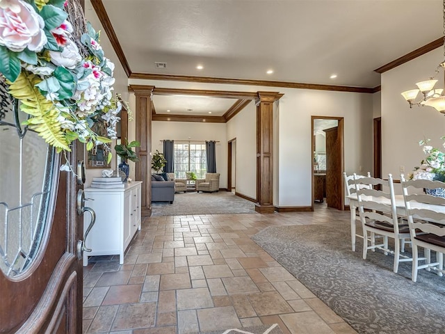 foyer featuring visible vents, stone tile flooring, recessed lighting, baseboards, and ornate columns