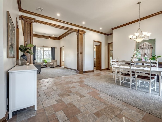 dining area featuring baseboards, visible vents, ornate columns, and stone tile flooring