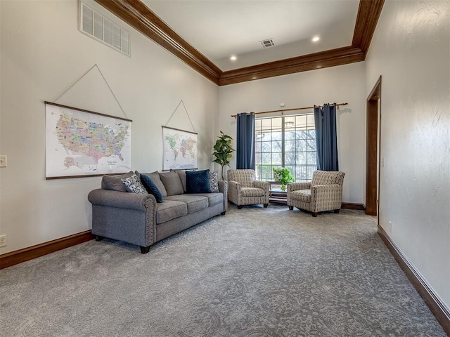 carpeted living area featuring recessed lighting, baseboards, visible vents, and ornamental molding