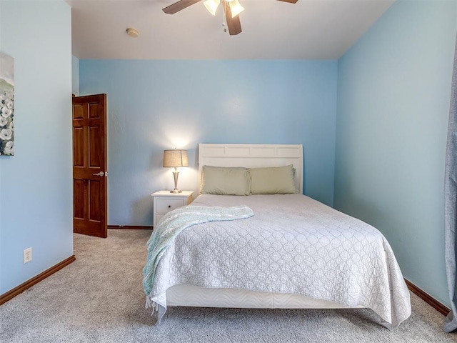 bedroom featuring baseboards, carpet, and a ceiling fan