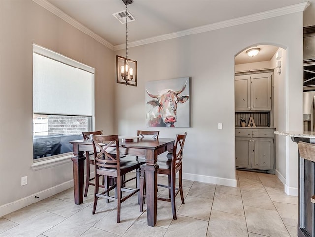 dining space featuring light tile patterned floors, visible vents, baseboards, and ornamental molding