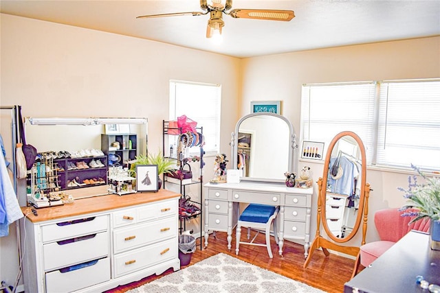 bedroom with ceiling fan and wood finished floors