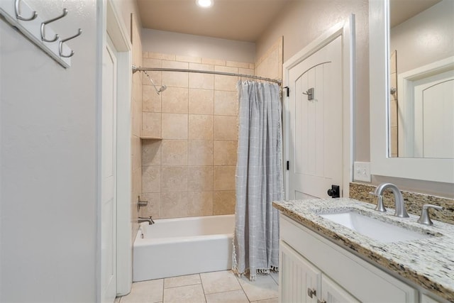 full bath featuring tile patterned floors, vanity, and shower / bath combo