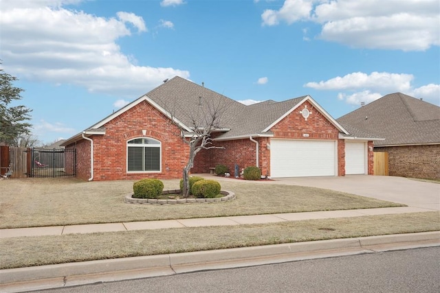 view of front of home with a gate, fence, concrete driveway, a garage, and brick siding