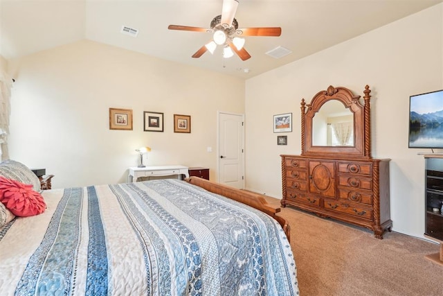 bedroom with visible vents, a ceiling fan, carpet flooring, and vaulted ceiling