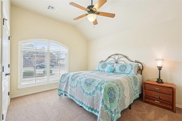 bedroom featuring a ceiling fan, visible vents, carpet floors, baseboards, and vaulted ceiling