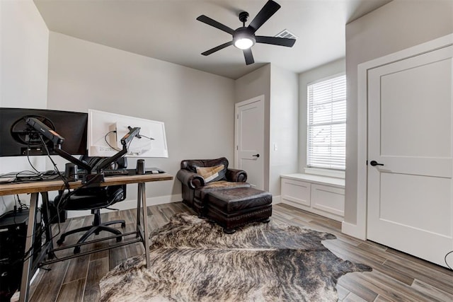 2580 Sunset Ct, Guthrie, OK 73044 - home office featuring a ceiling fan, wood finished floors, and baseboards