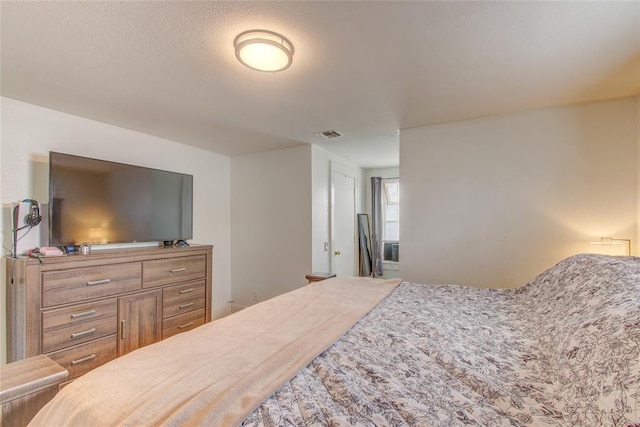 bedroom with visible vents