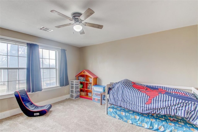 bedroom with visible vents, carpet flooring, a ceiling fan, and baseboards