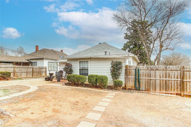 back of house with a patio area and fence