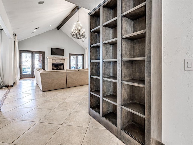 interior space with tile patterned floors, french doors, a fireplace, a chandelier, and vaulted ceiling with beams