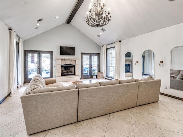 living room featuring french doors, beam ceiling, visible vents, and a fireplace