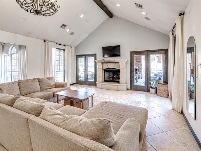 living area featuring visible vents, beam ceiling, high vaulted ceiling, french doors, and a fireplace