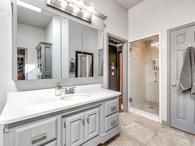 bathroom with vanity and a shower stall