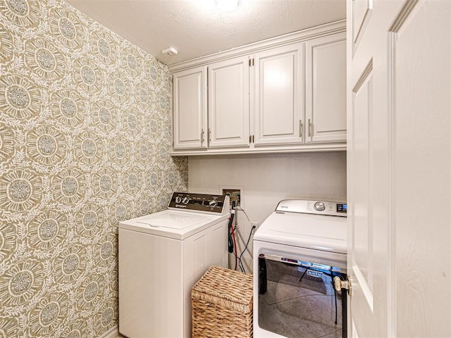 laundry area with cabinet space and washing machine and dryer