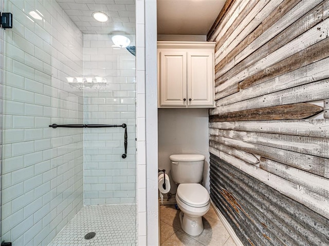 full bathroom with tile patterned flooring, toilet, and a stall shower