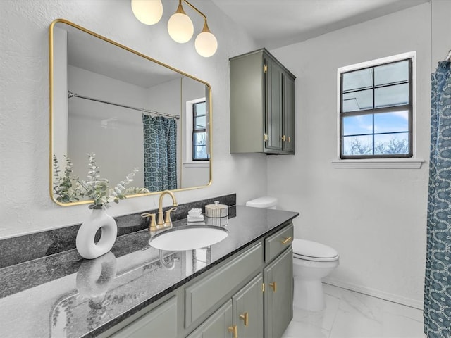 bathroom featuring vanity, a shower with curtain, baseboards, toilet, and marble finish floor