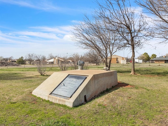 view of storm shelter with a lawn