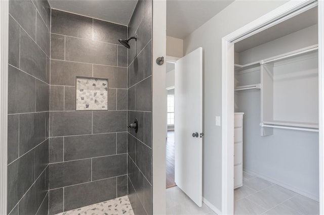 full bathroom featuring a tile shower