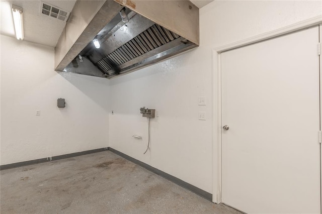 clothes washing area featuring visible vents and baseboards