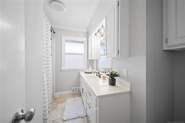 full bathroom featuring visible vents, crown molding, baseboards, a shower with shower curtain, and vanity