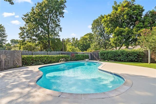 view of pool with a patio area, a fenced in pool, and a fenced backyard