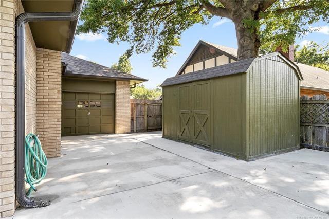 view of shed with fence