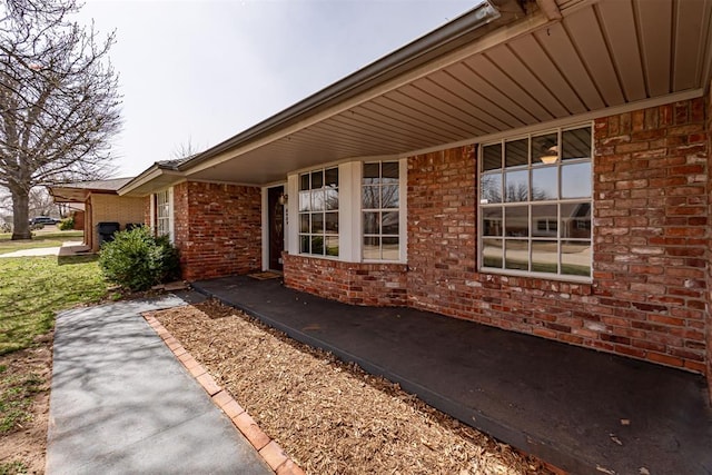 view of property exterior with brick siding