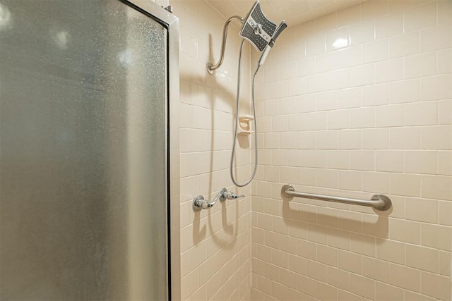 full bath with a shower stall