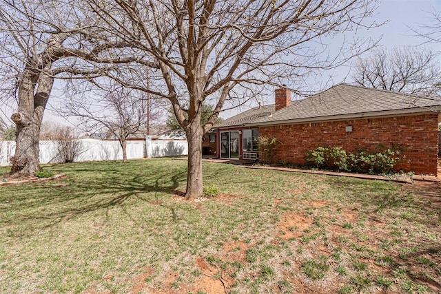 view of yard featuring fence