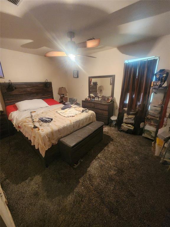 carpeted bedroom featuring ceiling fan