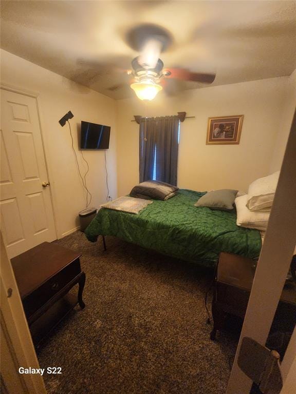 carpeted bedroom with a ceiling fan